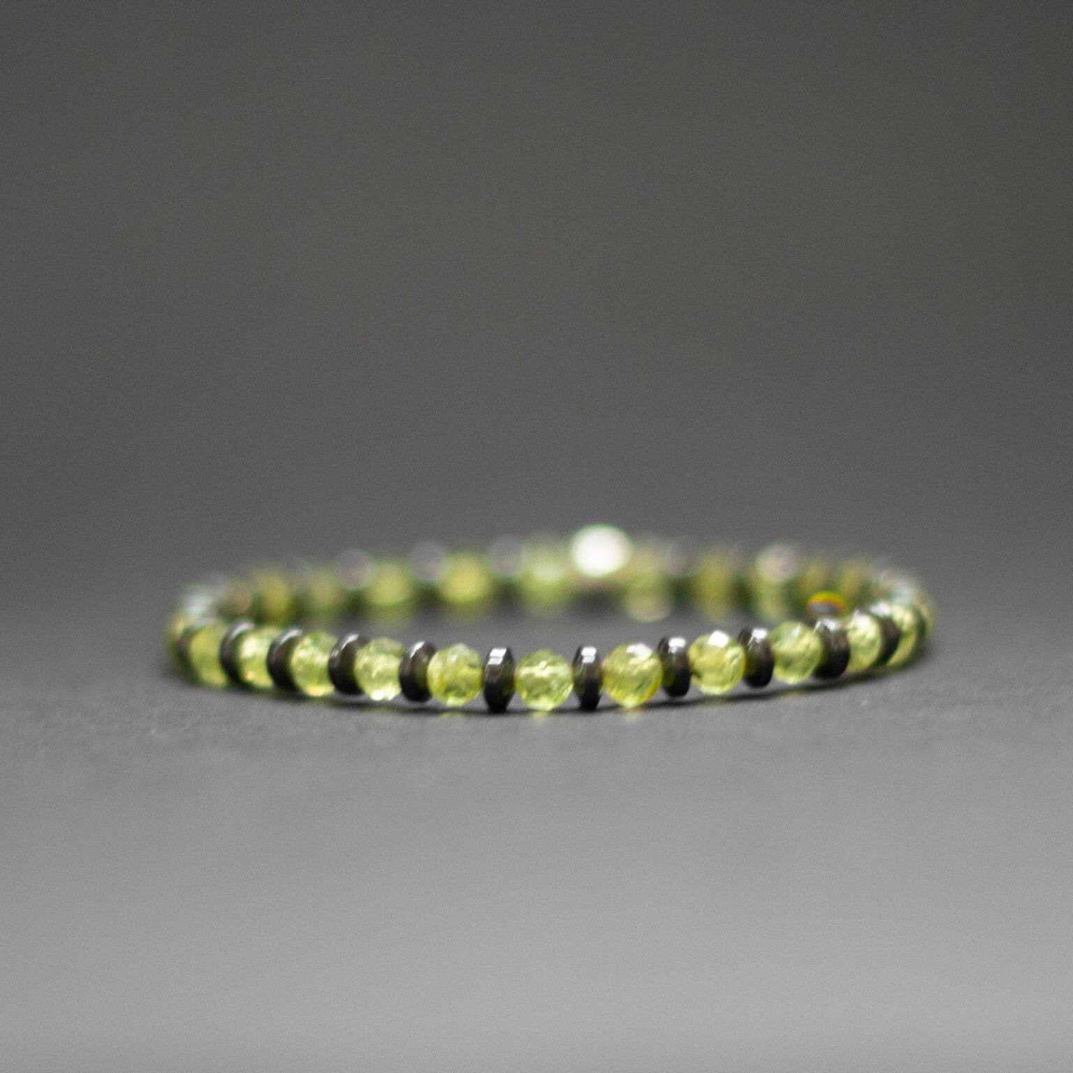 Peridot and grey Hematite Bracelet 4mm facet – Pulse Collection - Aquarius Stones
